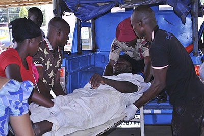 Rescue workers help one of the victims injured in yesterdayu2019s attacks. Net photo.