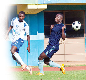 Junior wasps' striker Justin Mico (left) needed just two miutes to put Isonga infront against Police yesterday at Amahoro stadium. The New Times / T. Kisambira.