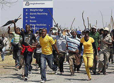 Mineworkers take part in a march outside the Anglo American mine in South Africas  North West Province. Net photo.