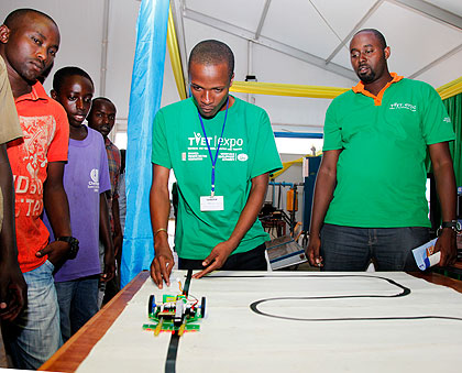 An exhibitor shows how a robot works during the pevious TVET Expo. The New Times / File
