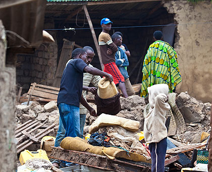 Residents sorting property from the debris of a house which was destroyed by heavy rains in Kimironko sector. The New Times / T.Kisambira.