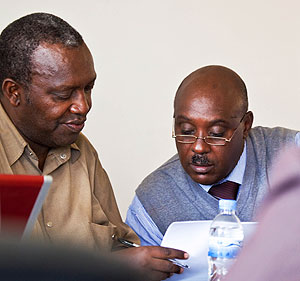 PAC members consulting from each other during the sesion. The New Times / T.Kisambira. 