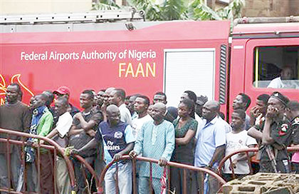 Residents stand behind a barricade . Net photo.