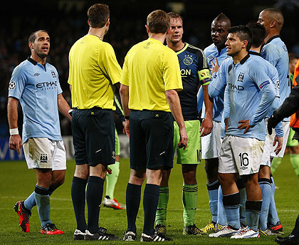 Manchester City's Sergio Aguero and team mates speak to officials after their game with Ajax at Etihad Stadium. Net Photo.