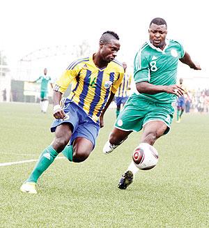 Mbuyu Twite, seen here in action against Nigeria during the first leg of the 2013 Afcon qualifier, has prefered to take a rest than playing for Amavubi. Sunday Sport / T. Kisambira.