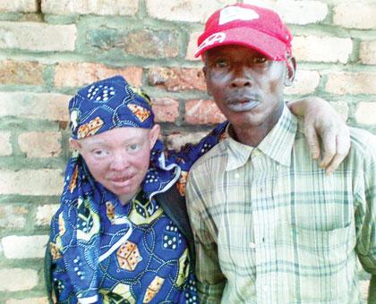 IN LOVE: Ntamugabumwe happily holds his wife Sifa Akimana. The Sunday Times / J.P Bucyensenge.