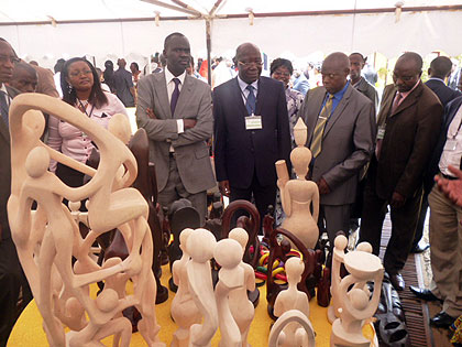 Minister of Natural Resources, Stanislas Kamanzi, with visiting delegates visiting stalls of Crafts. The New Times Courtesy.