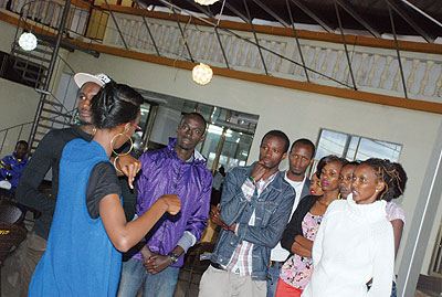 Sheila Mutavu talks to the models.