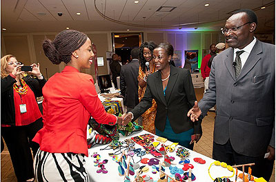 Teta Isibo welcomes ministers to her stand during the recent Rwanda Day in Boston, Massachusetts in the USA. The New Times / File.