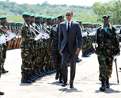 President Kagame inspects a parade during the pass-out of new cadet officers. The New Times / Village Urugwiro.
