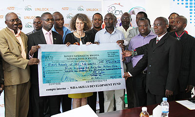 State Minister for Primary and Secondary Education, Mathias Harebamungu (2nd L) and World Bank Country manager Carolyn Turk (C) with WDA officials and winners. The New Times / T. Ishimwe.