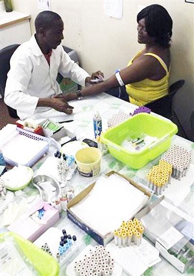 Christinah Motsoahae has blood taken for testing at the US sponsored u201cRight to Careu201d, Themba Lethu, HIV/AIDS Clinic, at the Helen Joseph hospital, in Johanneburg on Thursday, Nov. 15, 2012 