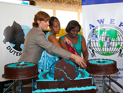  Susan Falatko, Public Affairs Officer, US Embassy, Martine Umubyeyi, President, Duterimbere, and Venantia Tugireyezu, Minister in the Presidentu2019s Office, cut a cake to mark the jubilee celebration. The New Times / T. Kisambira.