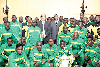 President Kagame (C) and Tanzaniau2019s Yanga FC players and officials at Village Urugwiro in August, this year. The club had paid a courtesy call on the President just days after lifting the Kagame Cup in Dar es Salaam. The New Times / File.