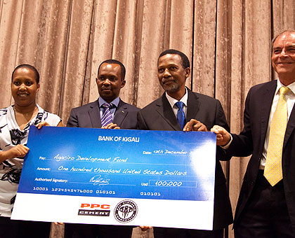 (L-R) Finance PS Kampeta Sayizonga, Rwandau2019s High Commissioner to South Africa, Vincent Karega, South Africau2019s HC to Rwanda, George Nkosinati Twala, and Paul Stuiver, CEO, PPC, as the latter presented a dummy cheque to boost the Agaciro Fund, yesterday. The New Times /T. Kisambira.