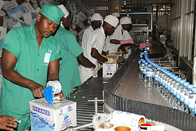 Workers in the water department of Inyange Industries Ltd. The company has introduced a new fruit juice brand. The New Times/File.