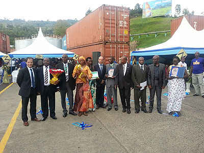 Some of the 25 long serving Bralirwa employees who were rewarded pose for a group photo with Western Provincial Governor Celestine kahizi (fourth Right) and the company's top management.