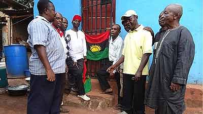  People in Enugu gather discreetly to sing the Biafran anthem and raise the flag. Net photo.