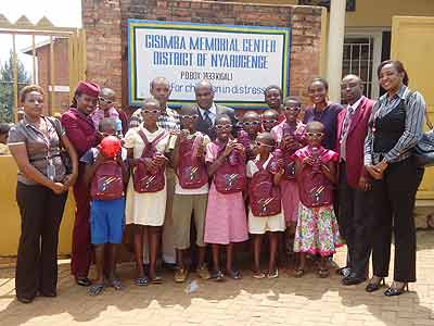 Staff members of Q. A with orphans. The New Times/T. Ishiimwe.