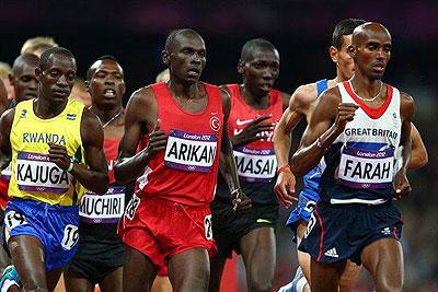 Robert Kajuga [in yellow] competing in the Menu2019s 10000m final alongside eventual winner Mo Farah of England during the 2012 Olympic Games held in London. The New Times / File.