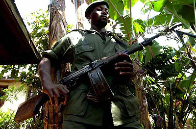 Mai-Mai militia fighters outside a hut in eastern Congo last year. Net photo
