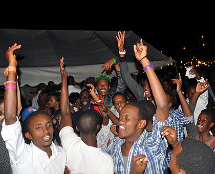 Kigali residents and others from the Diaspora welcome the New year at MINAFET gardens. The New Times/P. Muzogeye.