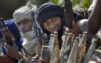 Chadian soldiers who are fighting in support of Central African Republic president Francois Bozize, sit in a truck full of rocket-propelled grenades on the road leading to Damara, about 70km (44 miles) north of the capital Bangui, Central African Republic. Net photo 