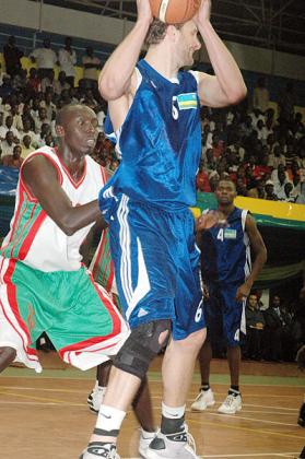 There is no place for former Rwandan captain Rob Thompson, seen here in action against Burundi during the 2009 Zone V qualifiers in Kigali as well as Honore Ayebare (right). The New Times/File.
