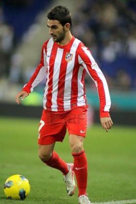 Wenger has been linked with a bid for Atletico Madrid striker Adrian Lopez. Net photo.