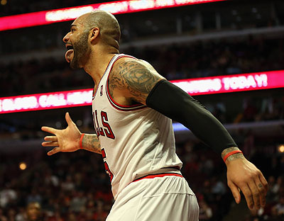 Carlos Boozer of the Chicago Bulls celebrates a three-point play against the Cleveland Cavaliers. Net photo.