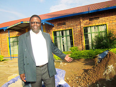 Bishop Ndashe shows the school St. Patrick Secondary School that is being renovated. The New Times/ E. Kwibuka