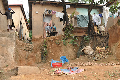 AT RISK: Children sitting outside their home. (Photo /  Cedric Ntwari)