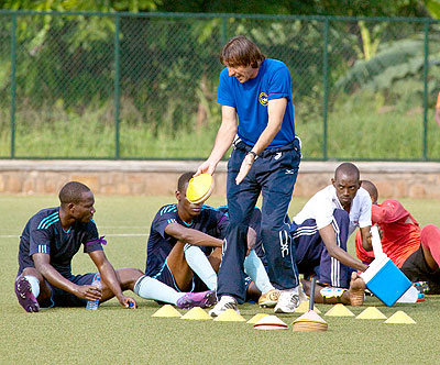 Police head coach Goran Kuponovic stresses a point to his players at half time of Wednesday's 3-0 win over Amagaju at Kicukiro ground. The New Times / T. Kisambira.