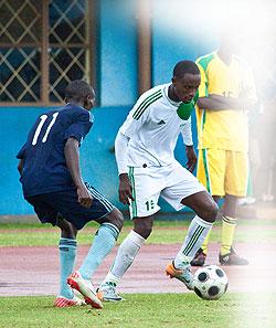 SC Kiyovu captain Eric Serugaba, right, seen here in action against Police FC in a recent league game, had threatened to quit the club if it doesnu2019t sort out itu2019s endless financial problems. Sunday Sport / T. Kisambira.