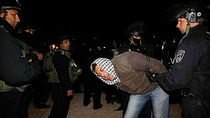 A protestor is forcefully ejected by police from a camp Palestine protestors had set up in an area earmarked for a Jewish housing project.. Net photo.