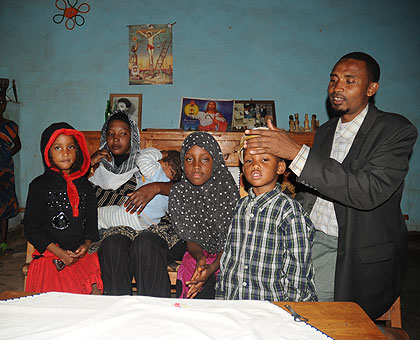  Tumukuze with his family at his fatheru2019s home in Muhanga district. The New Times/John Mbanda