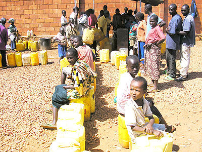 People queue for water in Kigabiro sector at the weekend. The New Times/ Timothy Kisambira