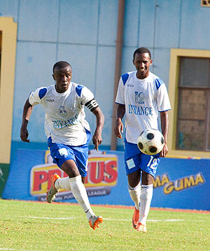 Isonga Fc skipper Robert Ndatimana (L) in action against Police Fc. The Clubu2019s management has sacked three members of the technical team citing performance.   The New Times / T.  Kisambira.