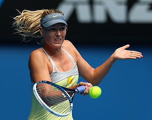 Sharapova plays a forehand in her first round match against Puchkova during day one of the 2013 Australian Open at Melbourne Park.   Net photo.