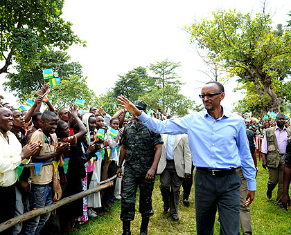  President Kagame greets the crowd gathered to welcome him in Rusizi. The New Times  / Village Urugwiro. 