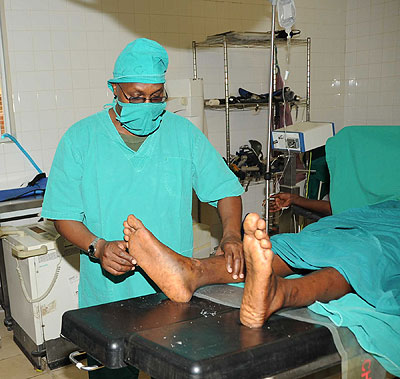 A medical worker examines a patient. Advanced and specialised medical services attract foreign nationals, earning a country foreign exchange. 
