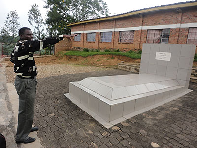The schoolu2019s current director, Leonard Gapasi stands at Mujawamahorou2019s tomb. Inset, Father Mvukiyehe.  The New Times/Jean Pierre Bucyensenge.
