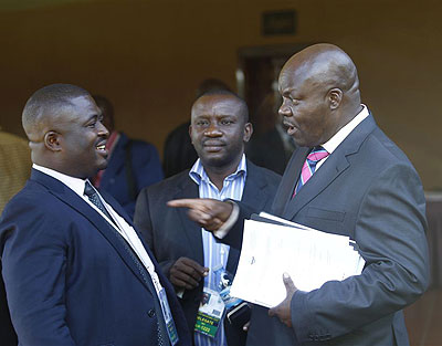 Roger Lumbala (R), a former member of parliament in the Democratic Republic of Congo who joined the M23 rebel group, chats with colleagues shortly after attending a peace talk meeting in Ugandau2019s capital Kampala, January 11, 2013.  Net photo.