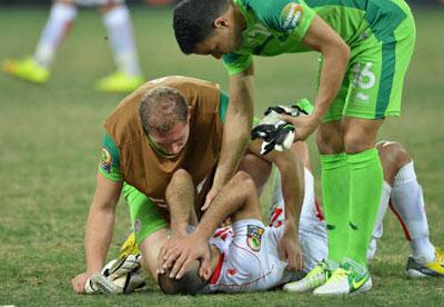 Farouk Ben Mustapha of Tunisia and Aymen Mathlouthi of Tunisia console Khaled Mouelhi of Tunisia after their loss. Net photo.