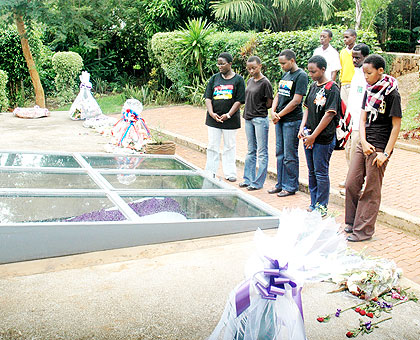 Relatives of victims of the 1994 Genocide against the Tutsi pay tribute at the Genocide Memorial in Kigali recently.  The New Times/ File.