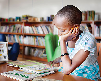 A pupil reads for pleasure in a school library. Such readings enhance academic excellence. The New Times/Timothy Kisambira.