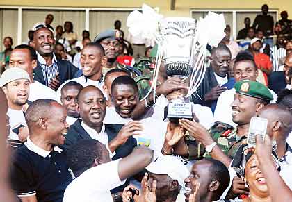 APRu2019s Officials, the Chief of Defence staff Lt. Gen. Charles Kayonga and Maj. Gen. Alex Kagame join APR fans and players to celebrate last yearu2019s League trophy.  The New Times / File. 