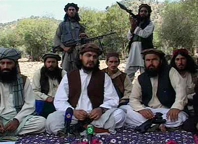 Pakistani Taliban chief Hakimullah Mehsud (centre) sits with other militants in South Waziristan October 4, 2009, in this video frame grab.  Net photo.
