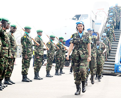 HEROIC WELCOME: A contingent of the Rwanda Defence Forces peacekeepers arrives at the Kigali International Airport yesterday from their tour of duty under the United Nations Mission in....