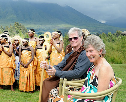 John and Mary Ann McDonald on their 75th tour of Virunga National Park are entertained by traditional troupes.  The New Times/ John Mbanda.